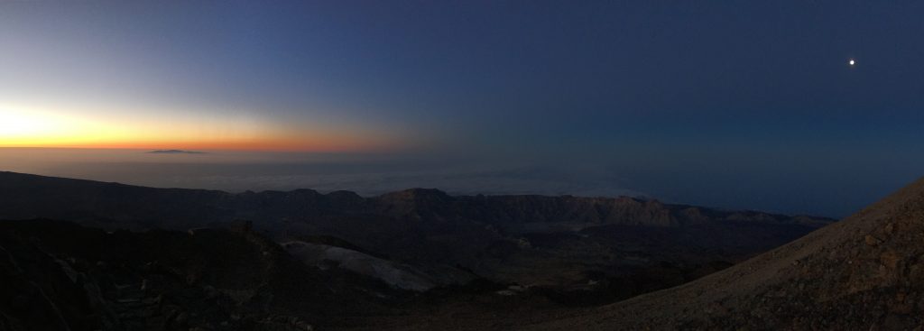 Sunrise and moon... and Gran Canaria island emerging from the sea of clouds